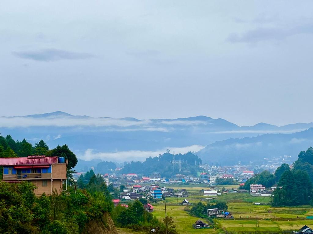 a view of a city from a hill at Holiday cabin in Sibey in Hāpoli