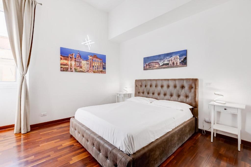 Ένα ή περισσότερα κρεβάτια σε δωμάτιο στο StarHome Colosseo