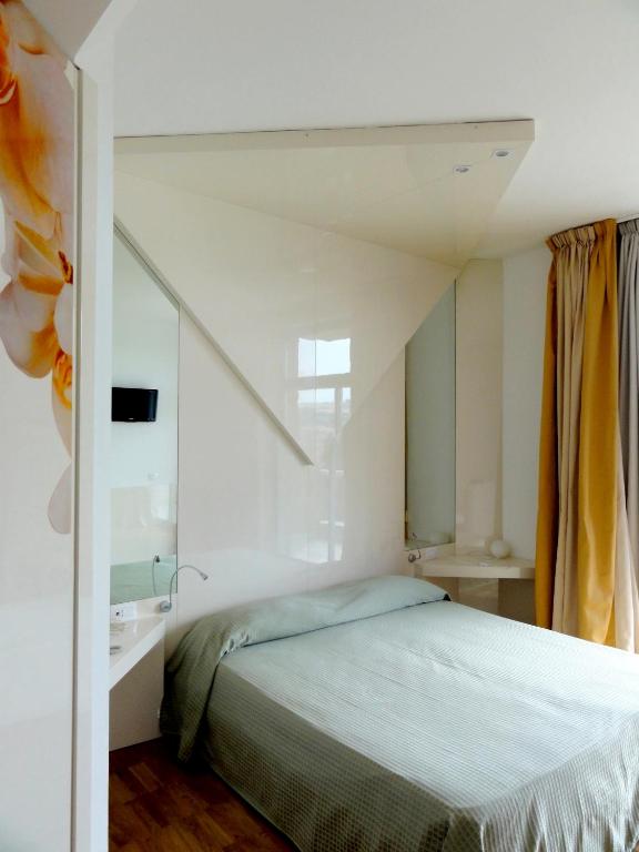 Postel nebo postele na pokoji v ubytování Hotel Excelsior