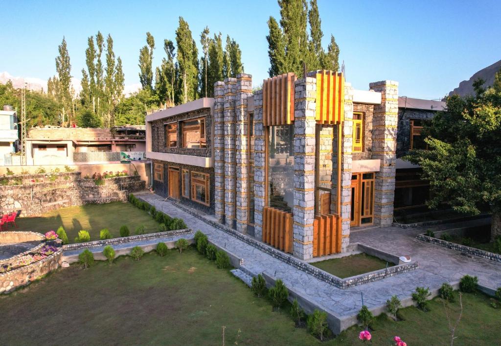 an aerial view of a building with a yard at Kesar Palace Hotel & Restaurant, Skardu in Skardu