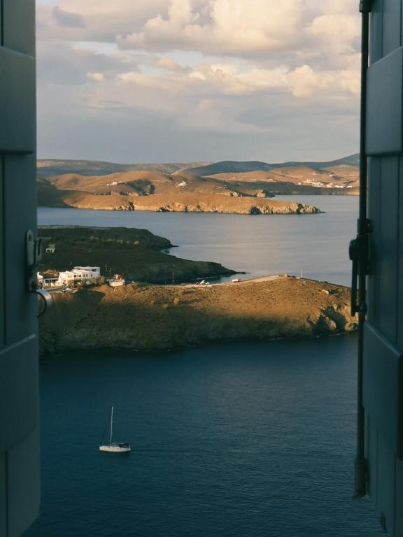 a boat in a large body of water at Akro Astypalea in Astypalaia