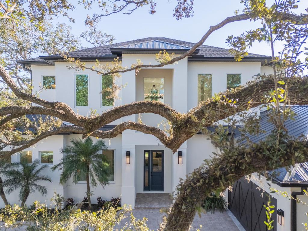a home with a heart shaped tree in front of it at New Contruction Modern Outdoor Oasis Prime Location in Southgate