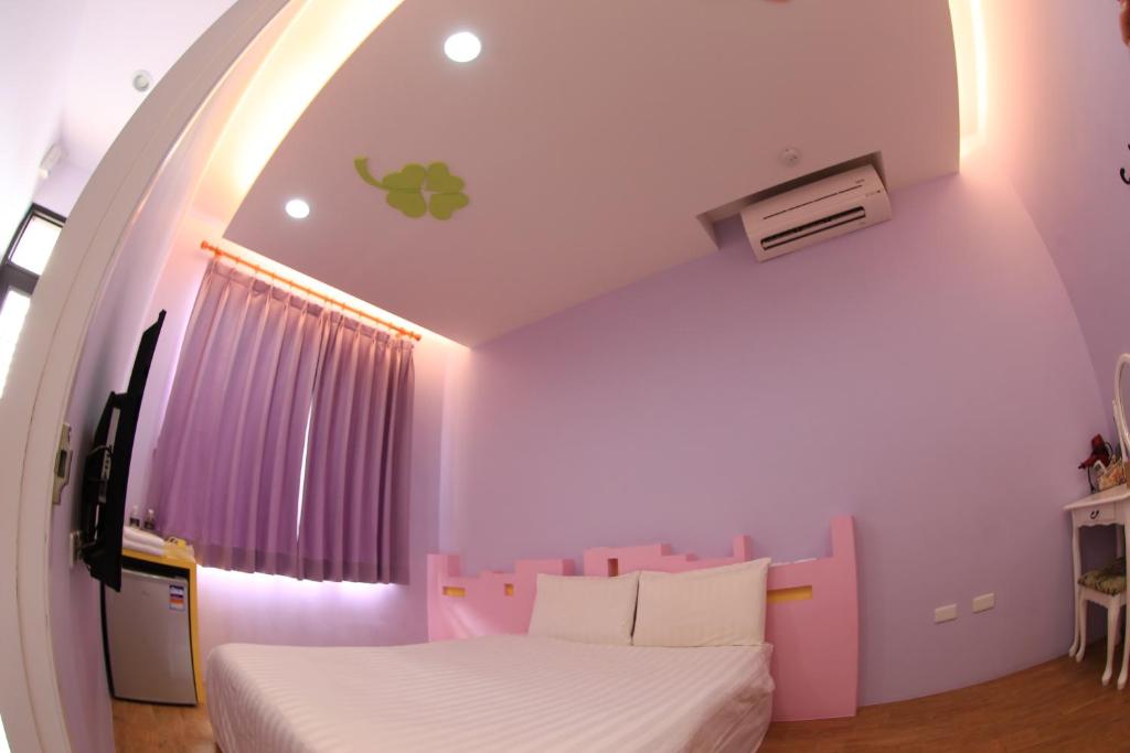 Postel nebo postele na pokoji v ubytování Happy B&B