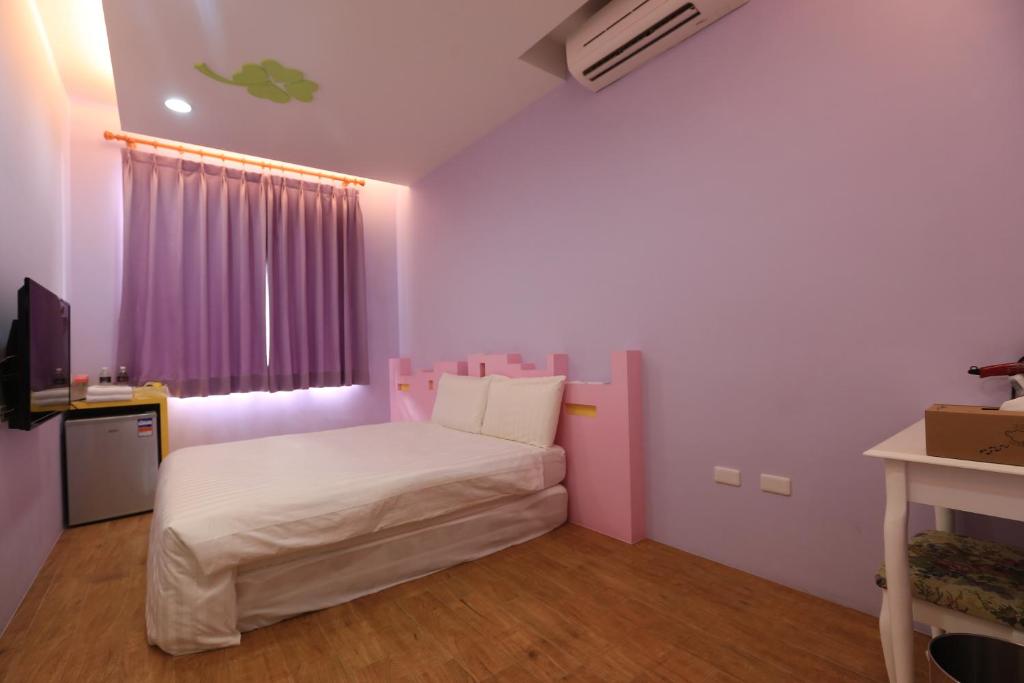 Postel nebo postele na pokoji v ubytování Happy B&B