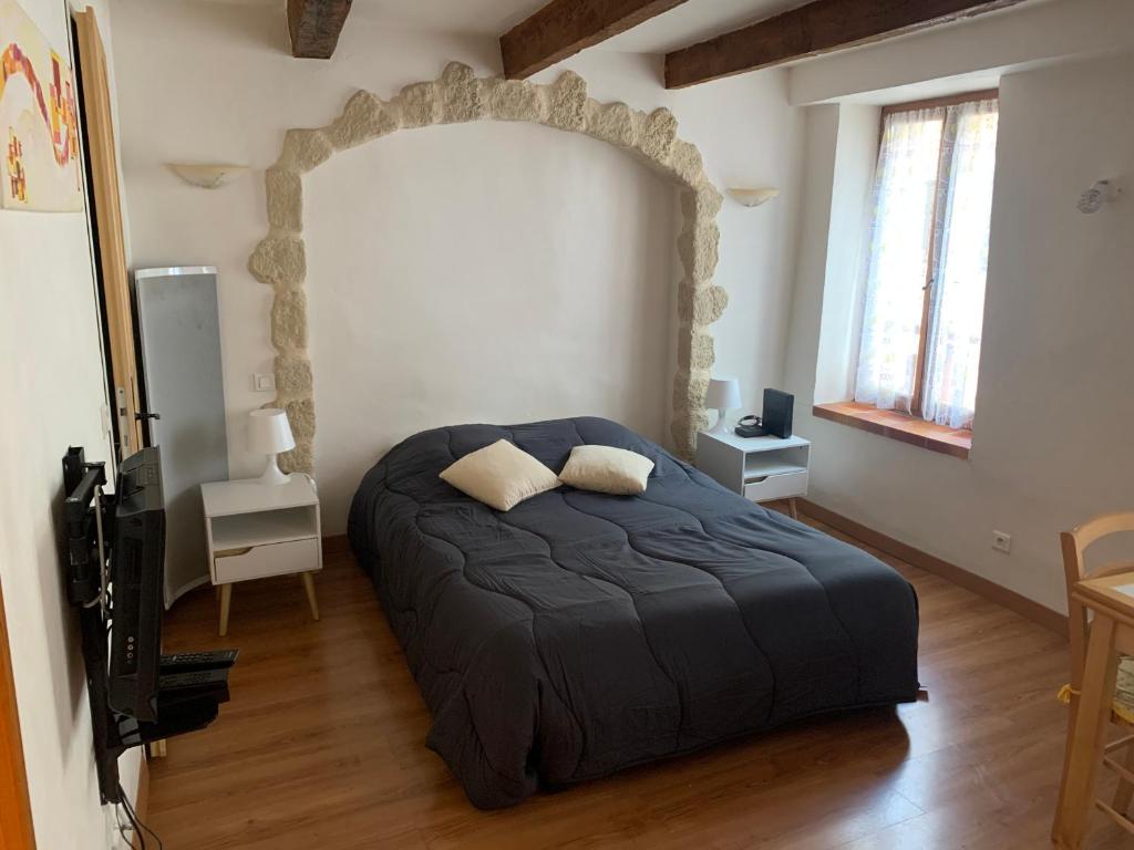 Ένα ή περισσότερα κρεβάτια σε δωμάτιο στο Studio isola village