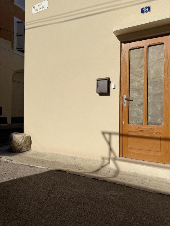 a door on the side of a building at la maison du soleil in Sigean