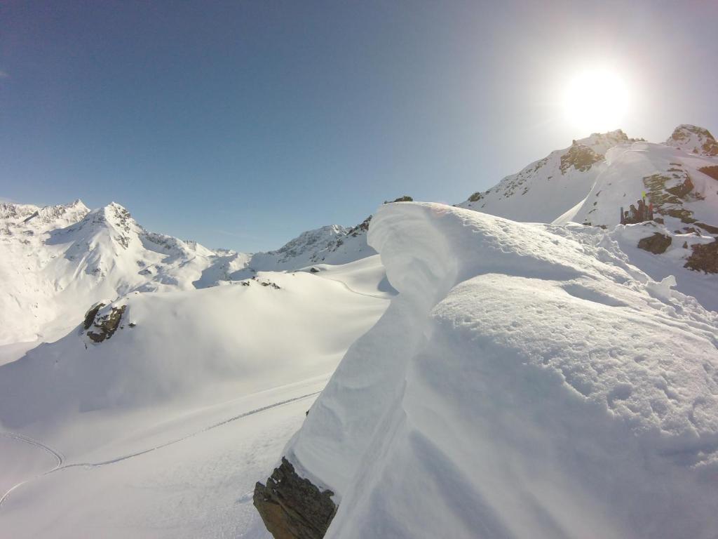 a pile of snow on top of a snow covered mountain at Arpege Des Neiges in Sainte-Foy-Tarentaise