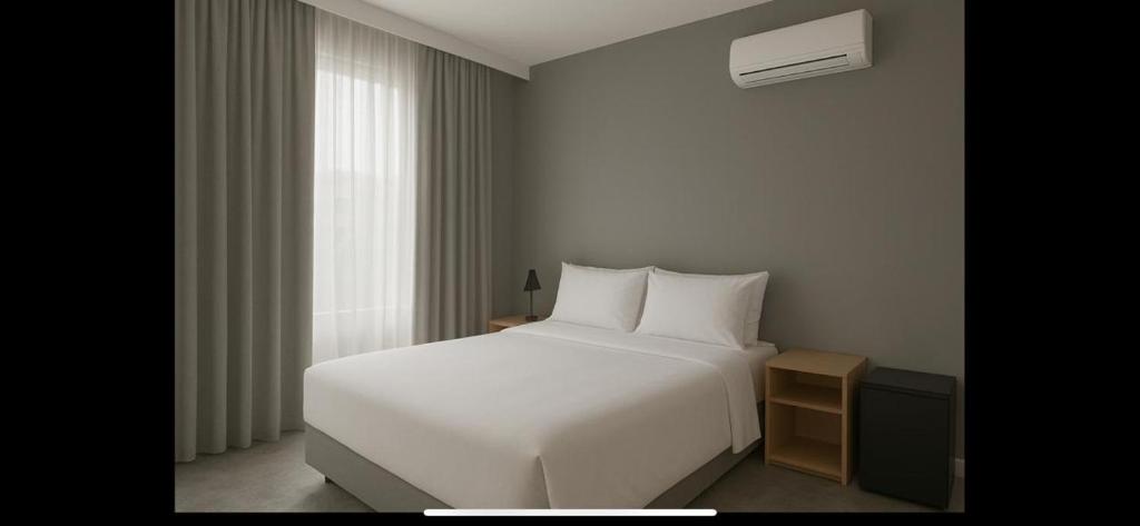 Postel nebo postele na pokoji v ubytování Hotel Catarina