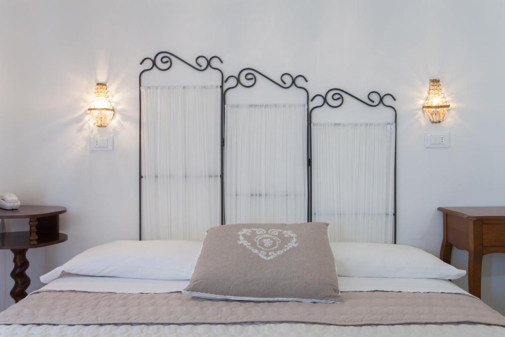 Postel nebo postele na pokoji v ubytování B&B Airone Cervia - Camere e Appartamenti