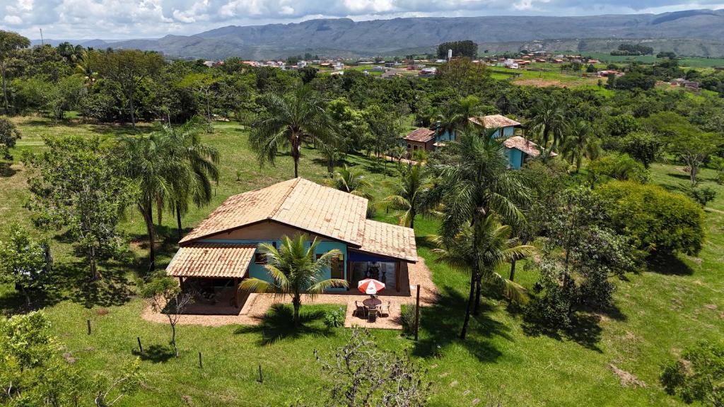 an aerial view of a small house in a field at Chalés Quinta da Nascente - Serra da Canastra in Delfinópolis