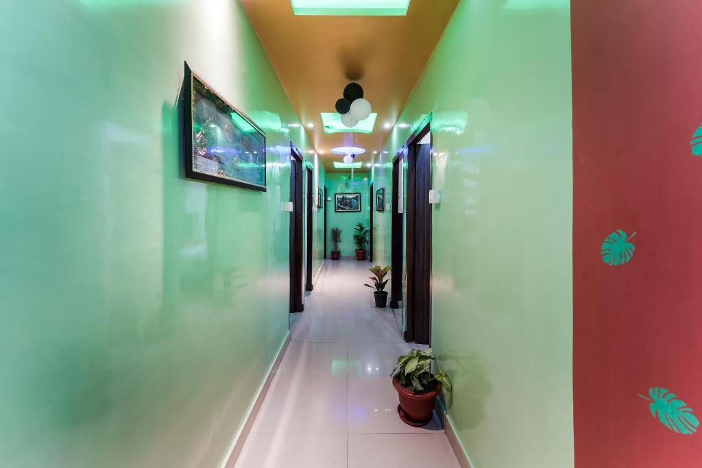 a corridor in a building with a hallway at Hotel O Landlord in Rohtak