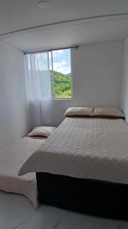 Postel nebo postele na pokoji v ubytování apartamento descanso villeta