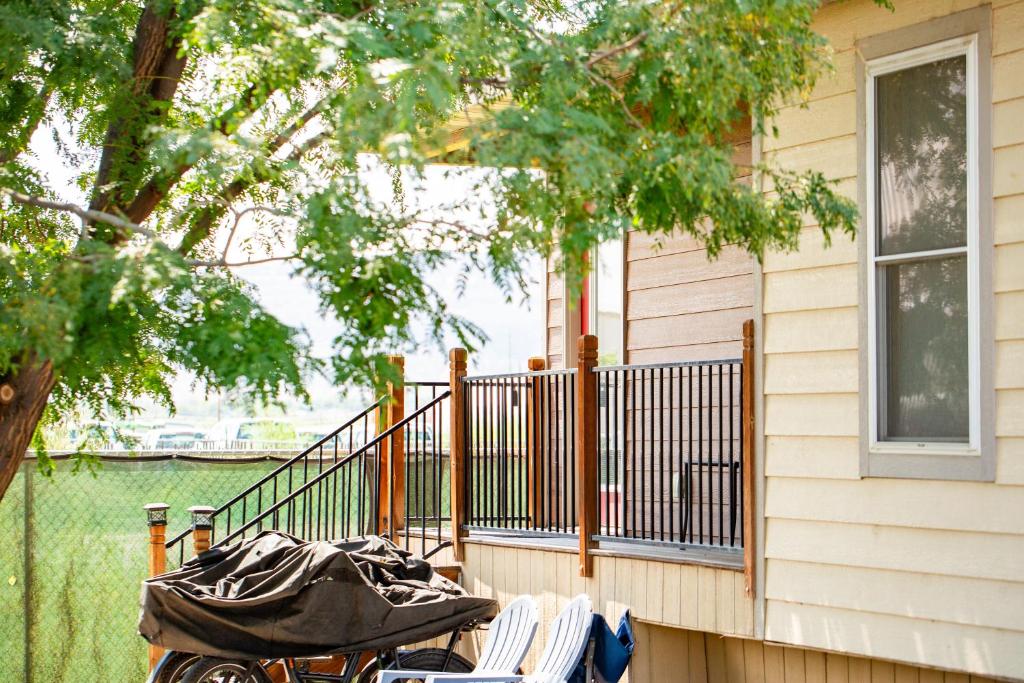 a porch of a house with a bunch of chairs at JW Grand Junction in Grand Junction