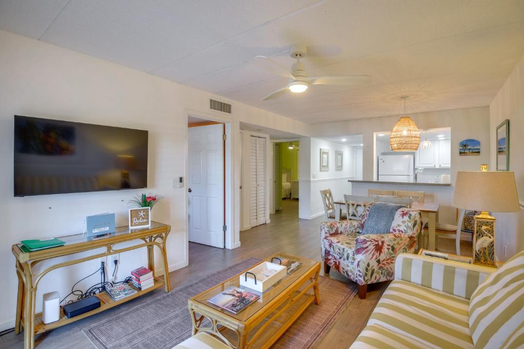 a living room with a couch and a table at St Augustine Condo w/ Pool Near Flagler College in Saint Augustine Beach