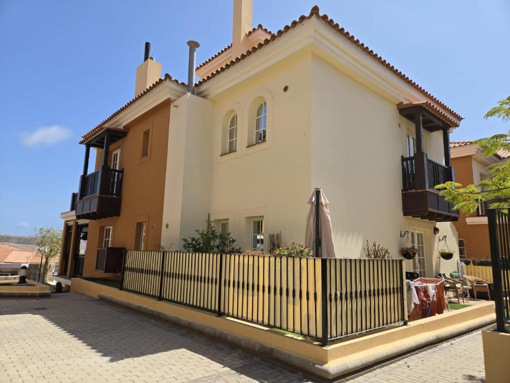 a house with a fence in front of it at Anastacia Studio in Arguineguín