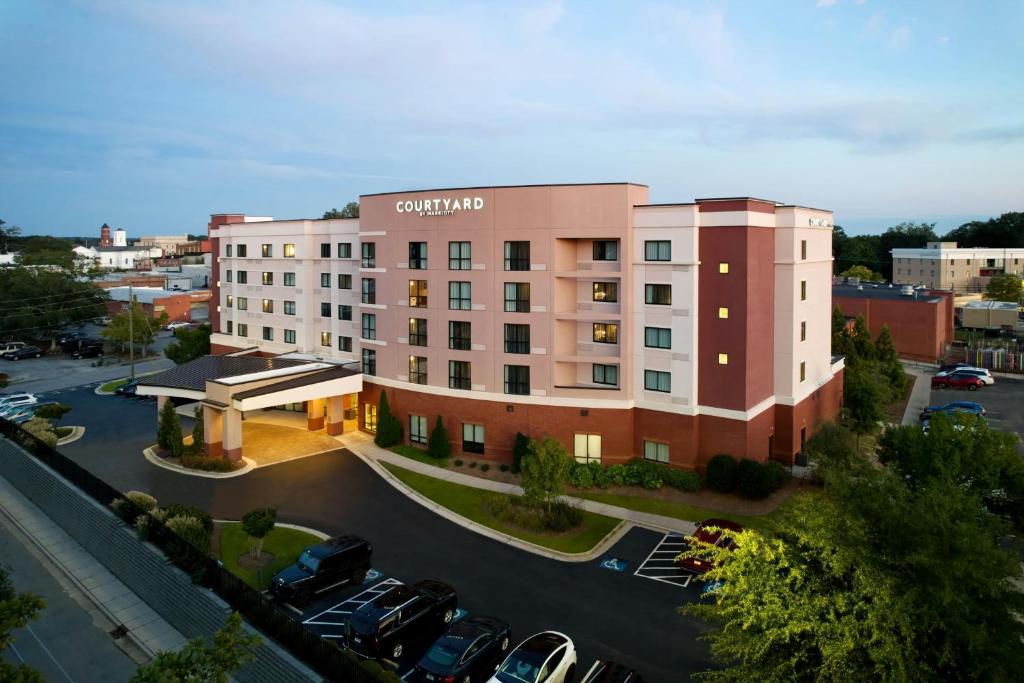a rendering of a hotel with a parking lot at Courtyard by Marriott Carrollton in Carrollton