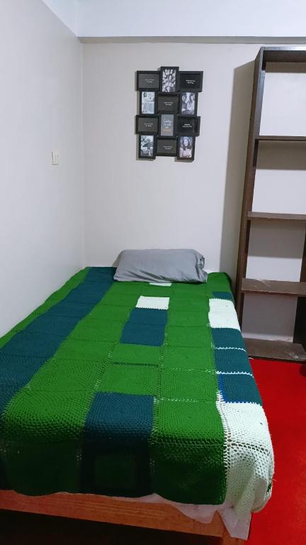 Ένα ή περισσότερα κρεβάτια σε δωμάτιο στο Casa hospedaje Palomino