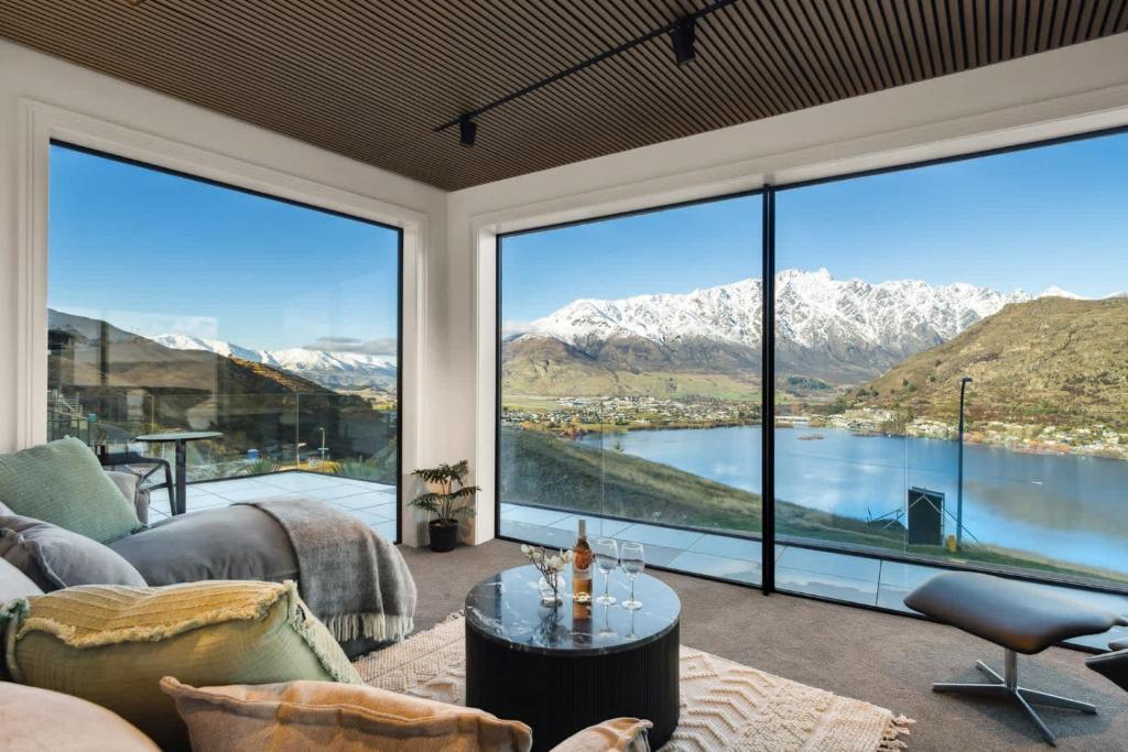a living room with a view of mountains at Elevated Tranquility Luxe Lakeview Horizons in Queenstown