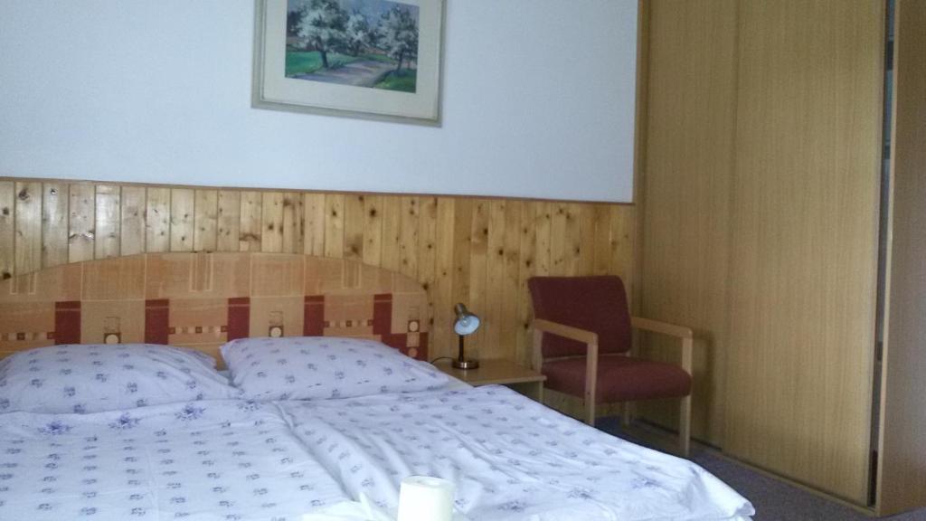 Postel nebo postele na pokoji v ubytování Penzion Vozzýk