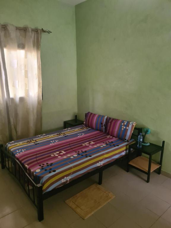 a large bed in a room with a window at Villa NINA in Yof