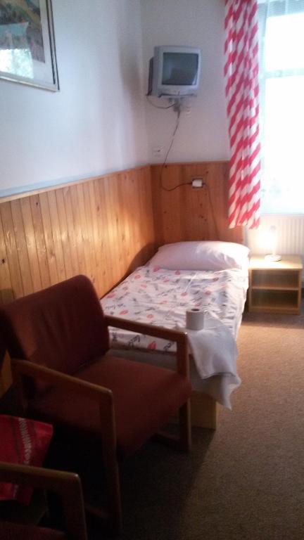 Postel nebo postele na pokoji v ubytování Penzion Vozzýk