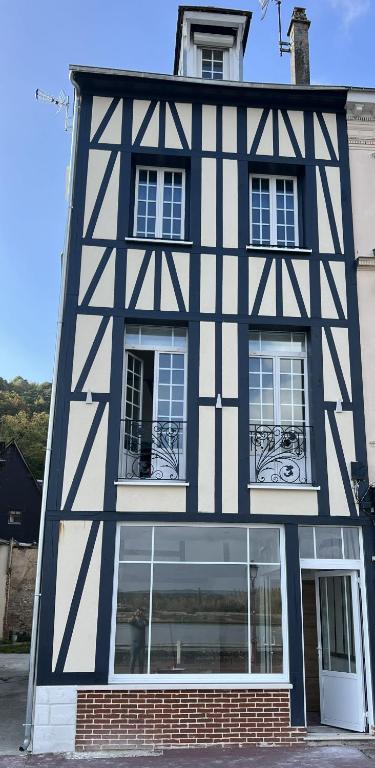 a black and white building with windows at Chez Fil'O in La Bouille