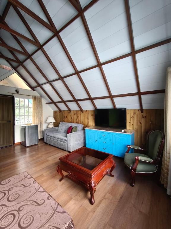 a living room with a couch and a table at Chalet Gardel in San Francisco
