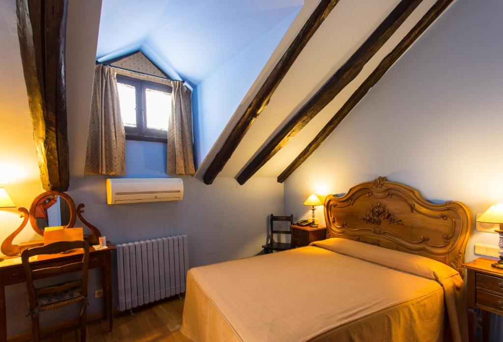 Postel nebo postele na pokoji v ubytování Hotel La Posada Regia
