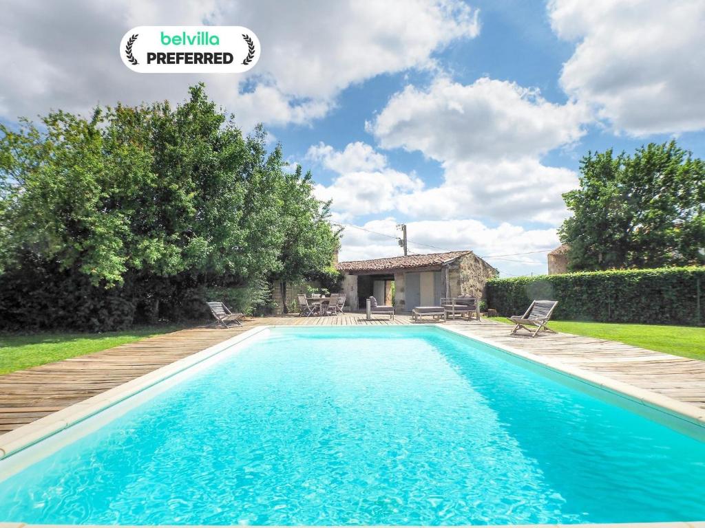 a swimming pool in the backyard of a house at Holiday Home Saint-Laurent Pool Retreat in La Chapelle-Thémer