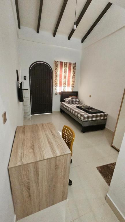 Katil atau katil-katil dalam bilik di Cute Room 1 at Pondok Raima SYARIAH