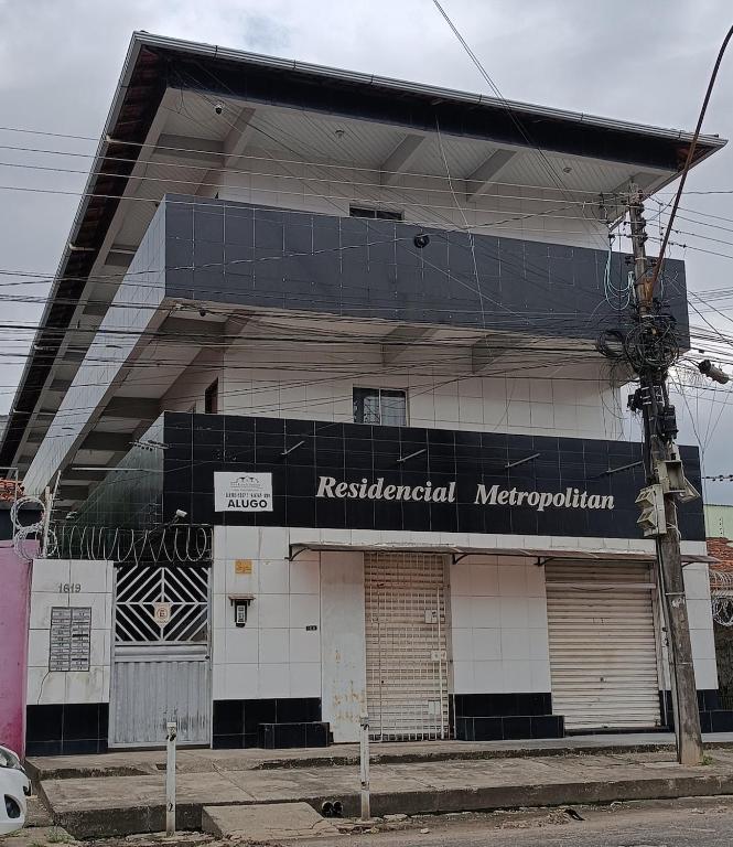a building with a sign on the side of it at Exclusive space in the Center, affordable accommodation in Castanhal