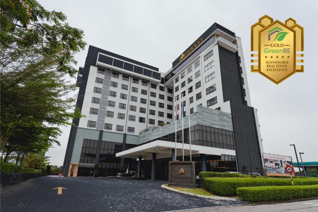 a building with a sign in front of it at Impiana Hotel Senai in Kulai