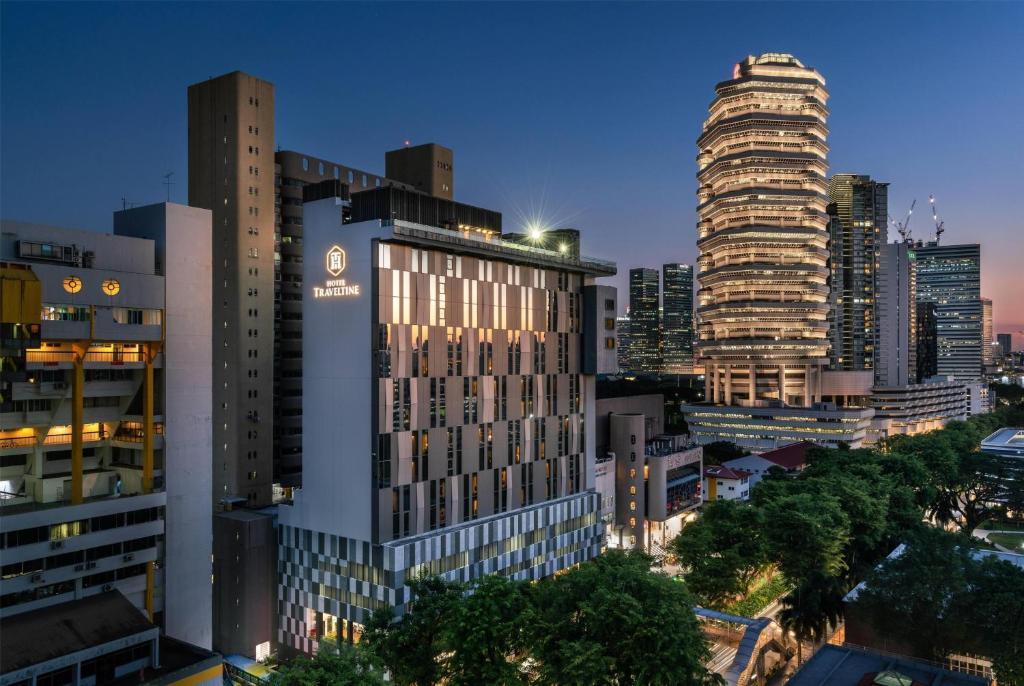 a view of a city skyline with tall buildings at Hotel Traveltine Downtown Singapore, Trademark Collection in Singapore