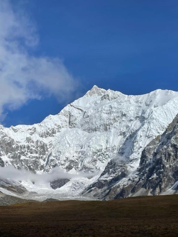 a snow covered mountain with a blue sky at Walk in the Himalayas in Pelling