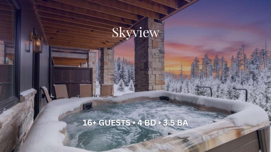 a jacuzzi tub in the snow on a cabin at Skyview in Fraser