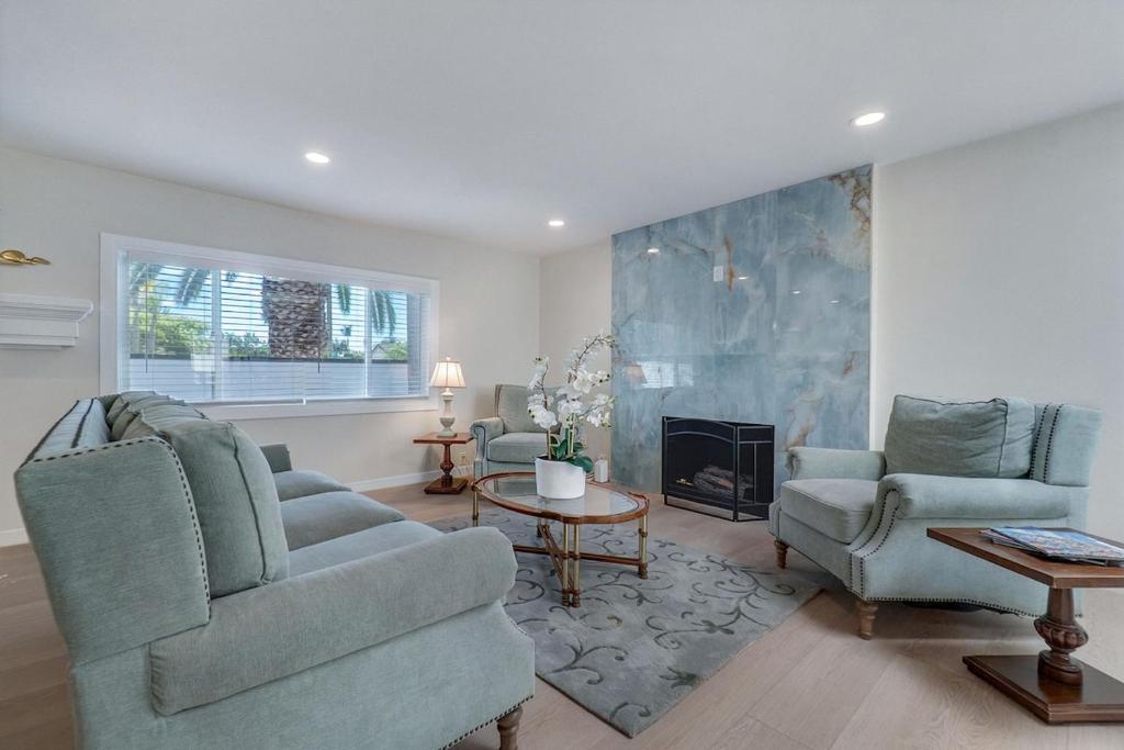 a living room with two chairs and a fireplace at Hey I Am Adriana On The Block Pool BBQ in Mission Viejo