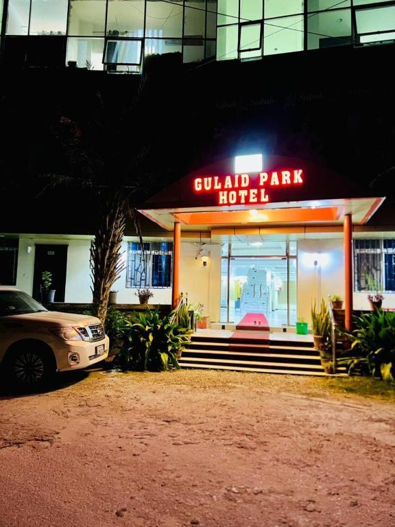 a car parked in front of a hotel at night at Gulaid Park Hotel in Hargeysa