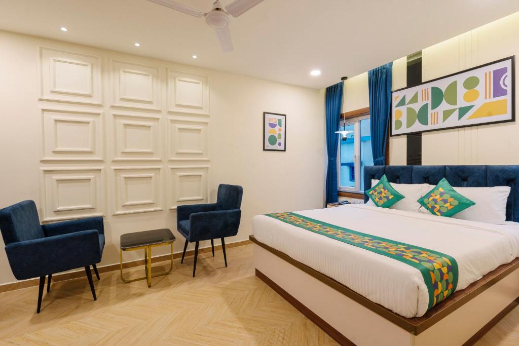 Postel nebo postele na pokoji v ubytování Treebo Premium Aasma Courtyard