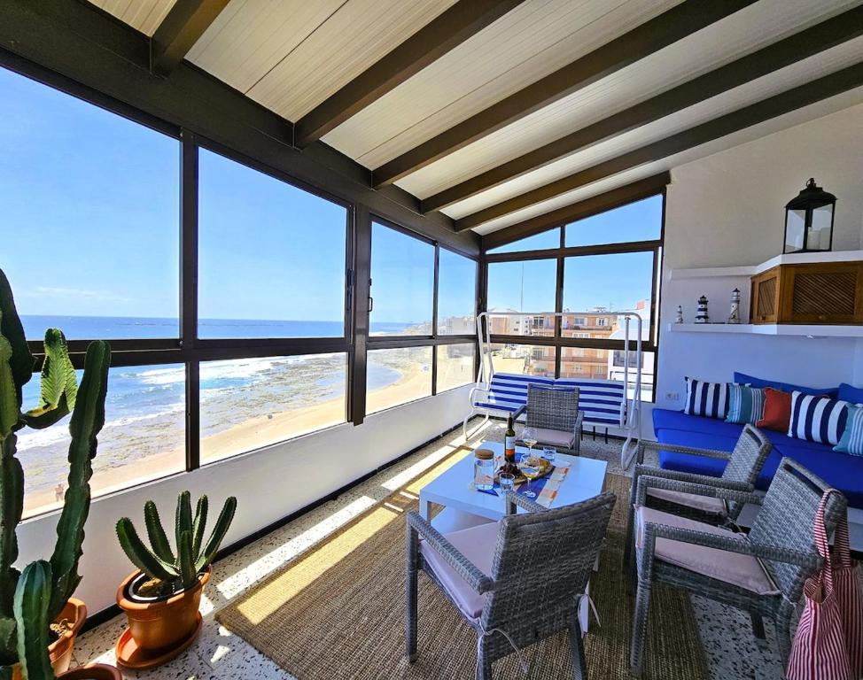 a living room with a view of the ocean at La Gaeta 1,Views above the Ocean in Telde