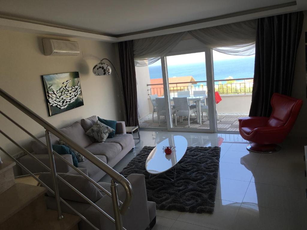 a living room with a view of the ocean at Elite Penthouse in Avsallar