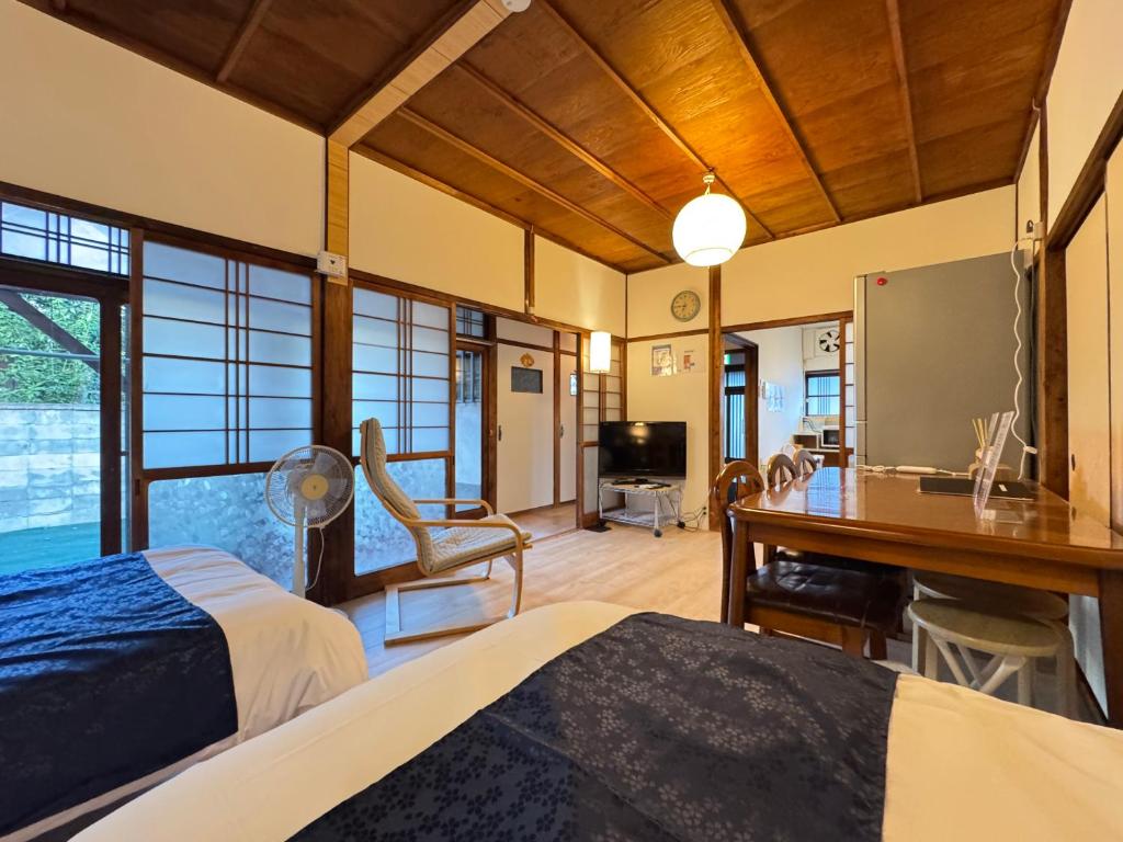 Ένα ή περισσότερα κρεβάτια σε δωμάτιο στο Jikka Japan