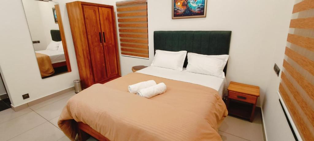Katil atau katil-katil dalam bilik di somainn Rooms near Trivandrum North Railway Station Kochuveli