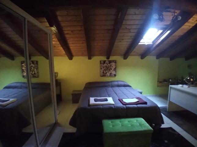 a bedroom with two beds in a room at Armony House in Trecastagni