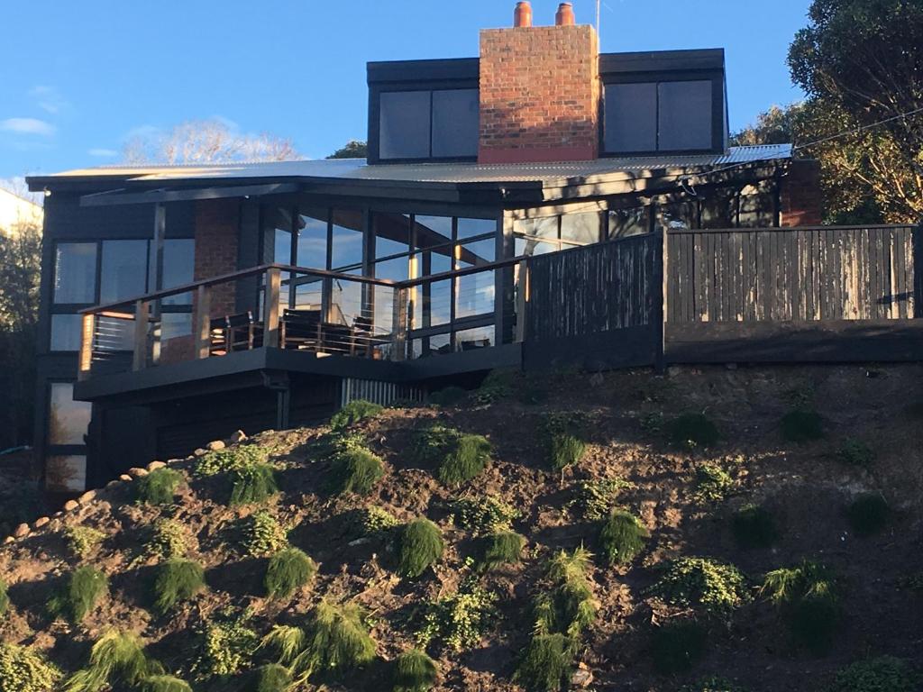 a house sitting on top of a hill at Ocean Views - Ocean Grove, Spectacular Family Home in sought after Location in Ocean Grove