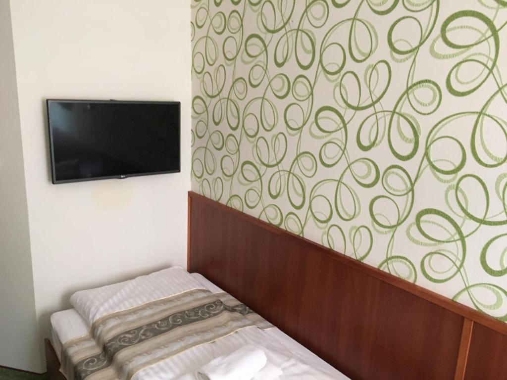 Postel nebo postele na pokoji v ubytování Partium Hotel Szeged