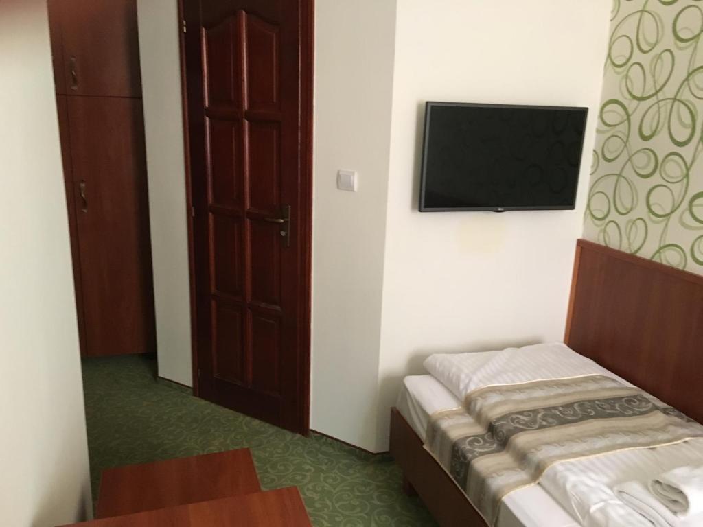 Postel nebo postele na pokoji v ubytování Partium Hotel Szeged