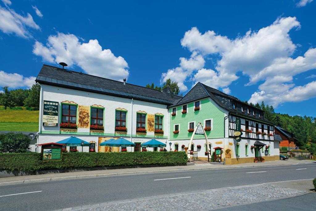 a large building on the side of a street at Hotel Gasthof zum Walfisch in Klingenthal