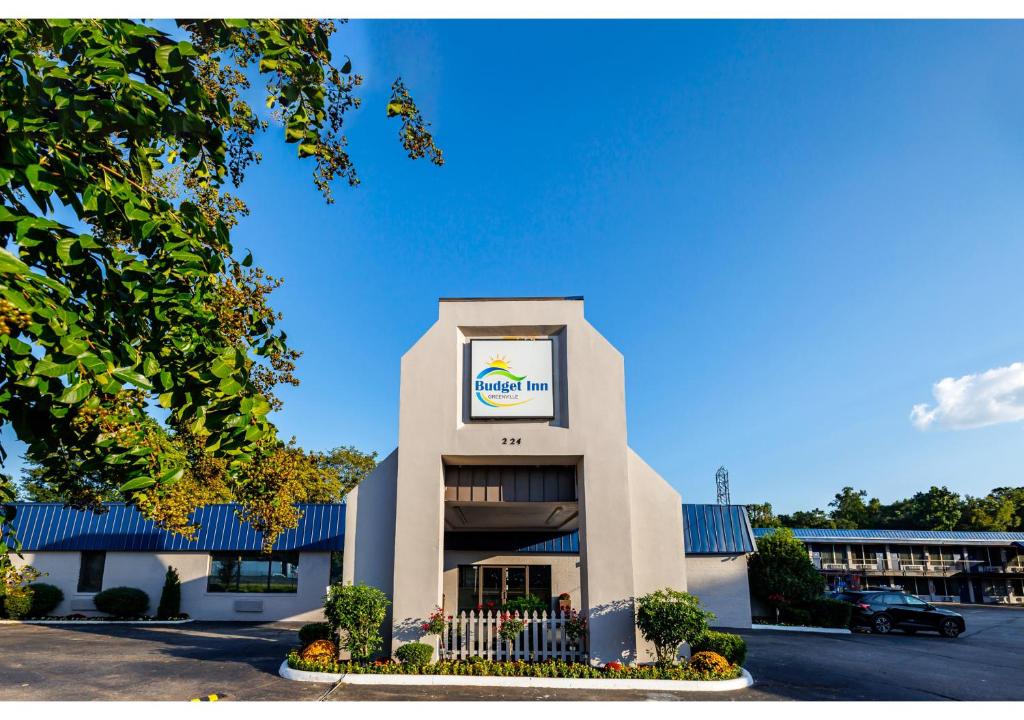 a building with a sign on the front of it at Budget Inn Greenville By Hotel O I-85 in Greenville