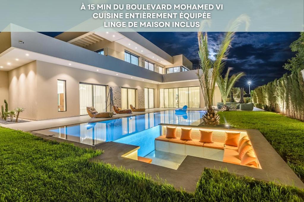 a house with a swimming pool in the yard at Villa Sofya - Roche Bobois Design & HD Wifi in Marrakesh