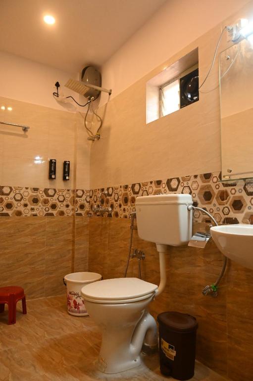 Ένα μπάνιο στο Aashirvaad Bed And Breakfast Homestay